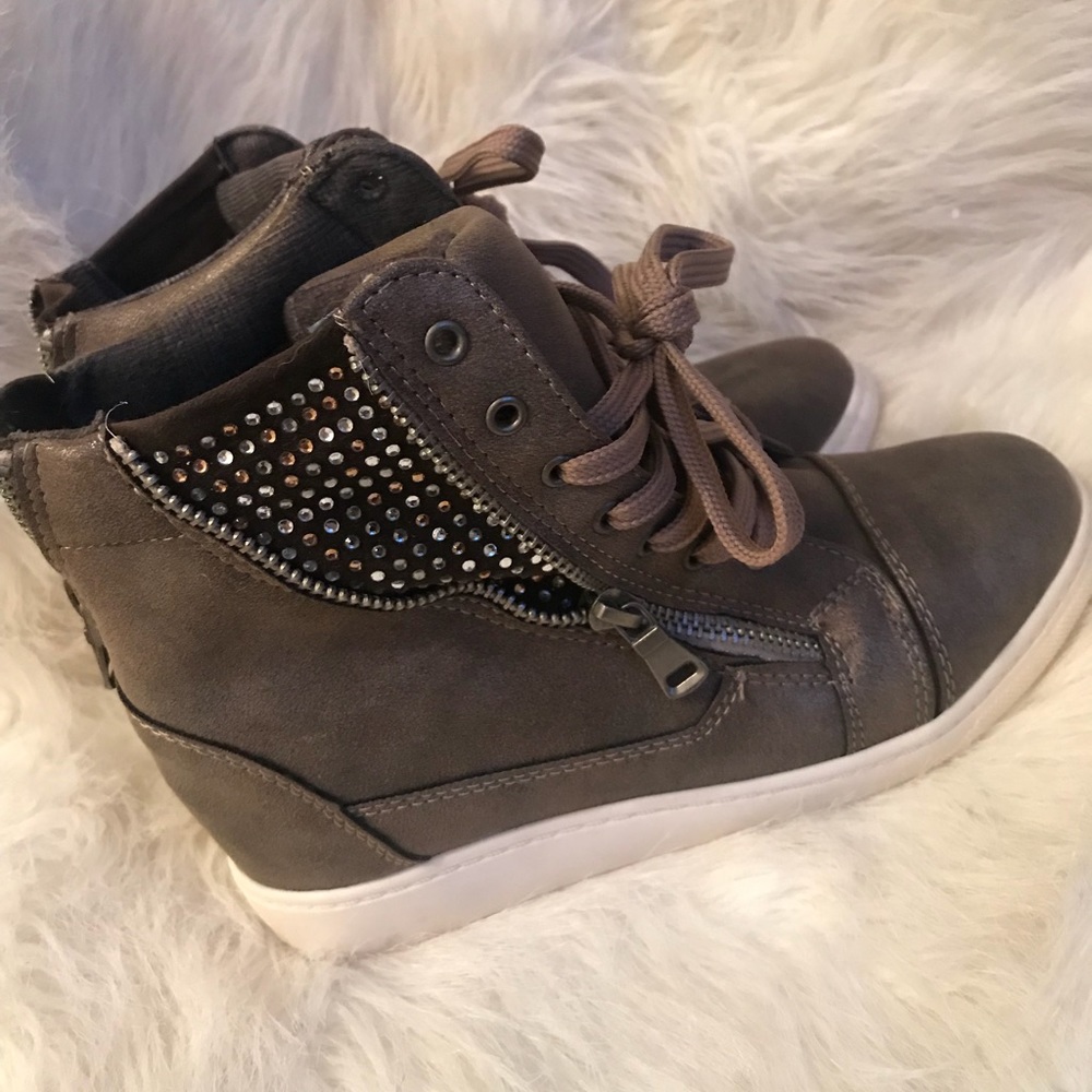 High Top Sneaker with a hidden 2inch wedge.